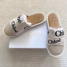 Chloe Woody Suede Slippers In White. Suede Slippers With Layered, Logo Adorned Straps And Rounded Toes. Slip-On Slides With Leather/Polypropylene Uppers, Leather Lining And Rubber Soles. Made In Portugal. Eu Size 40, Equivalent To Us 10. Brand New In Box, Includes 2 Dust Bags And Care Card. Beige Slides With Leather Sole And Round Toe, White Slides With Leather Sole And Round Toe, White Leather Sole Slip-on Slides, White Slip-on Flat Slippers, Cream Round Toe Slippers For Spring, White Closed Toe Slippers For Spring, Cream Slides With Removable Insole And Round Toe, Cream Leather Slip-on Slides, White Round Toe Slippers For Spring