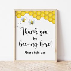 a sign that says, thank you for bee - ing here please take one