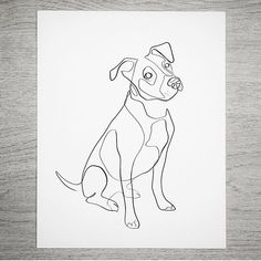 a black and white drawing of a dog sitting on top of a wooden table next to a piece of paper