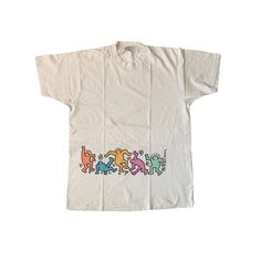 "Vintage 90s Keith Haring T-shirt Used condition. Has yellow stains. See pics! 100% cotton Single stitch THIS IS USED ITEM ! PLEASE DONT EXPECTED IT TO BE LIKE NEW OR IN PRISTINE CONDITION ! Size on tag: XL. Please check the measurements ! Measurements: Shoulders: 50 cm. (19.6\") Pit to Pit: 58 cm. (22.8\") Length: 82 cm. (32.2\") Worldwide Shipping: Approximate delivery time 14-30 days. Please be careful and ask any specific questions about item before purchasing. I can send you additional deta Cheap Throwback T-shirt With Direct To Garment Printing, Cheap 90s Inspired Cotton T-shirt, 90s Style Cotton T-shirt With Graffiti Print, 90s Style Relaxed Fit Graffiti T-shirt, Aaron Core, Special Forces Patch, Keith Haring Shirt, Keith Haring T Shirt, Husband Tshirt