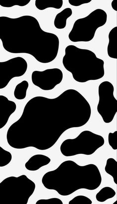 a black and white animal print pattern that looks like it has spots on the skin