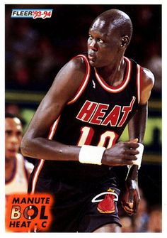 a basketball card with a man holding a ball in his right hand and wearing a wrist band