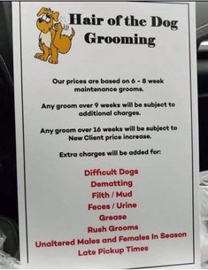 a sign on the back seat of a car warning people to keep their dogs from grooming