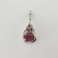 This is a beautiful red Ruby Pendant in 925 Sterling Silver. The metal is solid silver without any nickel or other substances causing most allergies making the jewelry hypo allergenic. Size of the Pendant (in total incl. Bail)   3.3 x 1.5 cm or 1.30 x 0.59 inch Please note: Our jewelry is photographed close up to show detail and may appear larger than they are. We are happy to help with any questions. You will receive the item in a gift box - perfect to surprise someone or yourself. Usually we s Red Teardrop Natural Stone Jewelry, Red Oval Jewelry With Polished Finish, Red Sterling Silver Jewelry With Polished Finish, Red Oval Pendant Jewelry With Polished Finish, Red Gemstone Oval Pendant Jewelry, Red Drop Gemstone Jewelry, Red Gemstone Drop Jewelry, Red Oval Natural Stone Jewelry, Red Garnet Drop Jewelry