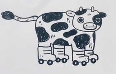 a drawing of a cow is shown on a piece of paper with roller skates