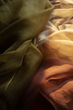 Ochre {Gossamer Silk Fabric} Hand-loomed, 100% organic silk fabric. This material has a unique body and texture. The light airiness of our gossamer silk creates a transparent veil of color when used for flatlay photography or vignette styling. Create a sculptural look when tucked and pinned. Creates a show-stopping look when draped on a table, or hanging as a backdrop. Planning a large event? Contact us for larger quantities here. Ochre Gossamer Silk Fabric has many uses! • Use as a transparent About Us Presentation Design, Draped Fabric Backdrop, Curtain Material Fabrics, Royal Colour Palette, Earth Tone Fabric, Silk Fabric Texture, Fabric Photography Ideas, Silk Photography, Maria Zhgenti