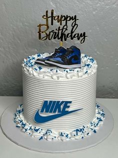 a birthday cake with a nike shoe on top