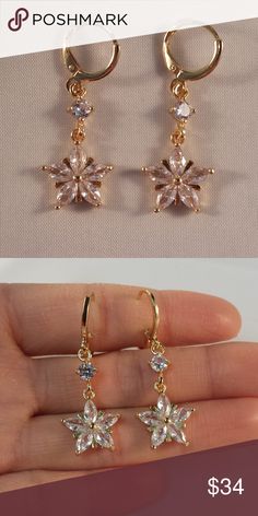 18K Yellow Gold Star Flower Topaz Zircon Earrings Theses beautiful star flower hoop pierced earrings are made of 18K Yellow Gold Filled with white topaz zircon (lab created) stones. Brand new, never been worn.Lead and nickel free. These fine quality earrings are perfect and comfortable all day, everyday wear, special occasions, or a special gift. Please send offers and questions.   Earrings: 1.38”x.51" Hoop Diameter: 11mm or .43" Fastening: Hoop clip (pierced) Jewelry Earrings Elegant Gold Star-shaped Crystal Earrings, Elegant Gold Star Shaped Crystal Earrings, Gold Crystal Flower Shape Earrings For Parties, Gold Cubic Zirconia Dangle Flower Earrings, Gold Dangle Flower Earrings With Cubic Zirconia, Elegant Yellow Dangle Flower Earrings, Gold Crystal Flower Shaped Earrings For Gift, Gold Crystal Flower-shaped Earrings For Gift, Gold Flower Shaped Crystal Earrings For Gift