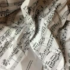 sheet music paper with musical notes printed on it, as well as the words in black and white