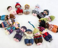 several knitted dolls are arranged in a circle