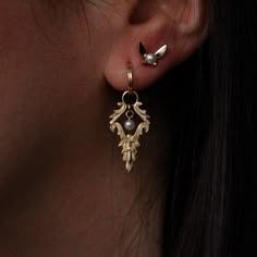 These might be the best earrings I've ever designed. Inspired by the Legend of Zelda, the Earrings of Destiny look medieval and modern at the same time. Each earring features a Japanese cultured pearl surrounded by decorative scrolls of gold and a tiny golden sword (the hidden treasure of the Kokiri). If you'd like, you can remove the hoop part of the earring, thread a chain through the bale and wear it as a pendant necklace!✶ solid 14 karat yellow, white, or rose gold✶ earring measures 12.1mm w Video Game Jewelry, Game Jewelry, Ewolucje Eevee, Rose Gold Earring, Traditional Jewellery, The Legend Of Zelda, Single Earring, Jewelry Inspo