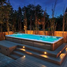 a hot tub sitting on top of a wooden deck