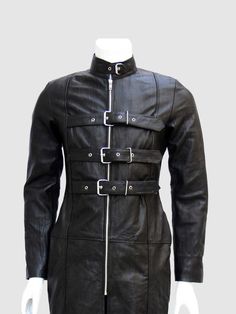 A leather coat should be two things; Durable and perfect in size. That is exactly what we are offering you with this Men's Gothic Leather Trench Coat. Best quality with great style and wonderful look. The super subtle black color is considered a favorite when it comes to leather apparel. The multiple buckles and belts at the front and on the collar are ready to give you that biker feel. The jacket comes with some amazing features to make it the perfect fit for your trendy wardrobe. You can not o Vampire Hunters, Men's Trench Coat, Knee Length Coat, Full Length Coat, Motorcycle Shop, Leather Trench, Custom Jacket, Leather Trench Coat, Fur Hood