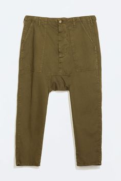 Baggy Ankle-length Bottoms With Patch Pockets, Baggy Ankle-length Pants With Patch Pockets, Cotton Drop Crotch Pants With Elastic Waistband, Baggy Ankle Pants With Patch Pockets, Baggy Long Pants With Patch Pockets, Baggy Green Bottoms With Patch Pockets, Green Straight Pants With Patch Pockets, Relaxed Fit Drop Crotch Pants With Side Pockets, Drop Crotch Bottoms With Side Pockets And Relaxed Fit