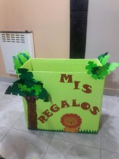 a cardboard box that says miss regalos with a lion and palm tree on it