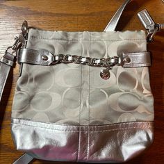 Coach Messenger Crossbody Silver And Gray New Without Tags. Inside Has 2 Slip Pockets And A Zip Pocket. Excellent Condition No Markings Or Ware Smoke Free Home. Silver Coach Bag With Adjustable Strap, Coach Silver Bag With Adjustable Strap, Coach Crossbody Purse, Black Leather Crossbody Bag, Coach Crossbody Bag, Black Crossbody, Coach Leather, Leather Pulls, Black Cross Body Bag