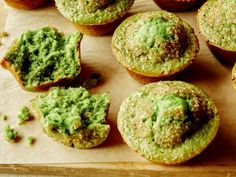 there are many muffins with green toppings on them