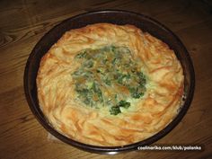 a baked dish with broccoli and cheese in a bowl