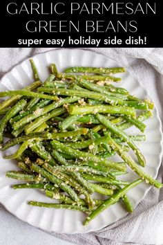 garlic parmesan green beans on a white plate with text overlay that reads garlic parmesan green beans super easy holiday side dish