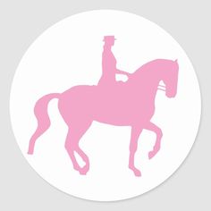 a pink silhouette of a horse and rider on a white background round paper sticker