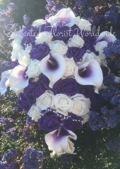 a bridal bouquet with purple and white flowers