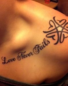 a woman with a tattoo on her chest that says live, never fail and cross