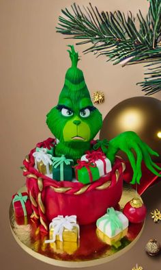 the grin face cake is decorated with presents