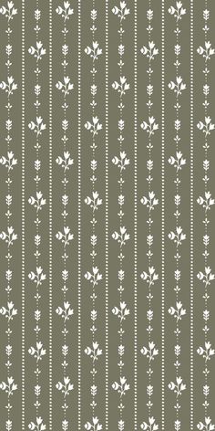 a gray and white striped wallpaper with small flowers on the bottom half of it