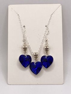 Add a pop of color to any outfit with this stunning Blue Crystal Hearts Necklace and Earrings Set. The heart-shaped blue crystal pendant and matching earrings are a perfect gift for any occasion, from graduations to birthdays and Valentine's Day. The set includes both the necklace and earrings, making it easy to complete any look. The crystals are made of glass and have a beautiful shine that will catch anyone's eye. The set is made in the United States and is a must-have for any jewelry collection. Crystal Heart Necklace, Earrings Making, Hearts Necklace, Necklace And Earrings Set, The Crystals, Blue Heart, Crystal Heart, Necklace And Earrings, Blue Crystals