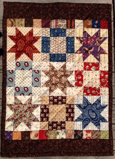 an old quilt with many different designs on it