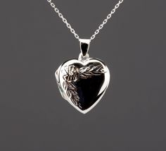 "A heart shaped locket necklace with flower and leaves stamped on the front:  1. a solid sterling silver heart shaped locket (21 x 21 x 6.3 mm without bale, 4.5 grams) that can hold two pictures inside.           It can be engraved on the front and back (use pulldown menu to select). The front can only hold one small initial at the lower right part.       2. Photo printing/insertion service also available (selected by pullodwn) at $14 each.      It you select this service, please send your photo Heart Shaped Locket, Flower And Leaves, Heart Photo, Photo Locket Necklace, Oval Locket, Memory Locket, Memorial Necklace, Grandmother Gifts, Mother Birthday Gifts