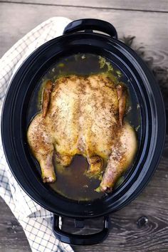 a cooked chicken in a slow cooker