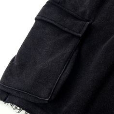 Baggy Cotton Black Cargo Shorts Beach - Raw Edge Helms - The baggy black cargo shorts are instantly eye-catching in the urban setting. Carefully crafted from 320GSM high-quality combed cotton with a breathable French Terry interior, these comfy shorts are tailored to a laid-back fit with design details that make them stand out from other cargo shorts. The side accordion pockets provide functionality and a structured look, while the distressed hem adds a rugged and edgy touch that contrasts perfe Baggy Streetwear Shorts With Multiple Pockets, Cotton Techwear Shorts With Pockets, Urban Baggy Shorts With Pockets, Baggy Streetwear Shorts With Side Pockets, Baggy Shorts With Pockets For Streetwear, Baggy Cargo Shorts With Side Pockets For Streetwear, Cotton Techwear Shorts With Cargo Pockets, Cotton Techwear Cargo Shorts, Techwear Cotton Shorts With Cargo Pockets