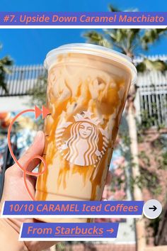 a hand holding up a cup of caramel iced coffee with the words upside down caramel macchiaia on it