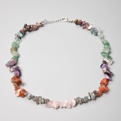 "Chakra Stones  Necklace Details: Gemstones: Amethyst, Iolite, Lapis Lazuli, Green Aventurine, Jade,Yellow Aventurine,Jasper Gemstone type: Irregular chips Total length: 40cm/16\"+extends to 45cm/18\" ... Check out the full catalogue of beaded necklaces here: https://www.etsy.com/shop/PaleoGemsJewellery?section_id=40958762 🔹Please note While you're checking out the photos, remember that each gemstone is like a fingerprint - totally unique. Colors and shapes play differently in each piece, making them one-of-a-kind. Our pics are snapped under some bold lights to highlight their beauty, but your actual piece might have its own little variations. 🔹Caring for gemstones Wait for your body lotions and perfumes to set in before you put on your jewelry. Ensure your jewelry is stored in a dry env Chip Bead Necklace, Gemstone Choker Necklace, Aventurine Necklace, Gemstone Choker, Chakra Necklace, Natural Gemstone Jewelry, Chip Beads, Chakra Crystals, Jasper Gemstone