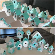 there are many bird houses on the table