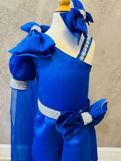 Amazing unique fun fashion outfit in royal blue color - satin royal blue romper with organza sleeve and 2 removable bows on the shoulder and waist. Organza cape is removable. Zipper side. This outfit can be made  in any size and colors. Outfit is tailored to order in any standard size. The size chart is the picture of the listing. For custom  outfit we would need: chest, waist, hips and height, length from shoulder to waist, from waist to floor. Recommendations for care: Dry cleaning or hand was Blue Satin Dress For Costume Party, Royal Blue Royal Style Dress For Party, Royal Blue Dress For Pageants, Elegant Fitted Blue Pageant Dress, Blue Pageant Dress With Ruffles For Party, Elegant Blue Pageant Dress For Party, Elegant Blue Pageant Dress, Royal Blue Royal Dresses For Costume Party, Sparkly Romper