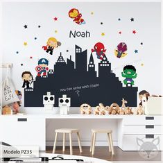 a child's room with wall decals and toys on the desk in front of it