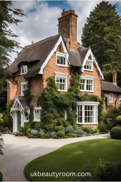 a large brick house with ivy growing on it's roof and windows in the front