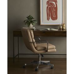 an office chair sitting in front of a desk with a plant on top of it