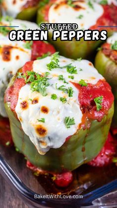 stuffed green peppers in a glass dish with sour cream on top and fresh basil sprinkled on top