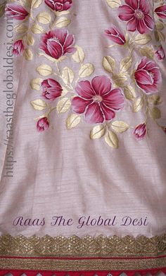 a pink and gold flowered blanket with the words raas the global desi on it