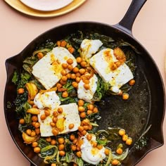 a pan filled with food on top of a table