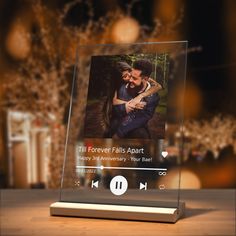 an image of a couple on the screen of a music player that is being displayed