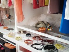 the closet is filled with various items and accessories for women's wear, including bracelets