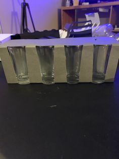 three empty glasses sitting on top of a table