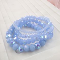 Our Glass Doll set comes in size M (7) and is a gorgeous stack of crystals bracelets. Elevate your wrist with a pop of color, these do come in a stack of four to create the ultimate vibe for your look. Bracelets Baby Blue, Blue Crystal Bracelet With Stackable Round Beads, Trendy Blue Stackable Stretch Bracelet, Trendy Adjustable Blue Crystal Bracelet, Trendy Blue Bracelets With Faceted Beads, Crystals Bracelets, Milky Pink, Glass Dolls, Doll Set