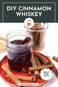 homemade cinnamon whiskey in a glass jar with cinnamon sticks