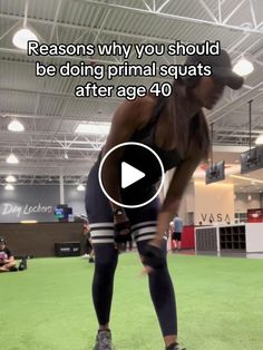 a woman standing on top of a green field in front of an audience with the caption reason why you should be doing animal squats after age 40