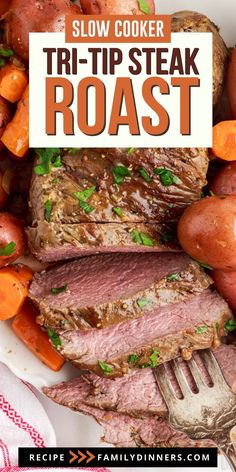 slow cooker tri - tip steak roast on a plate with carrots and potatoes